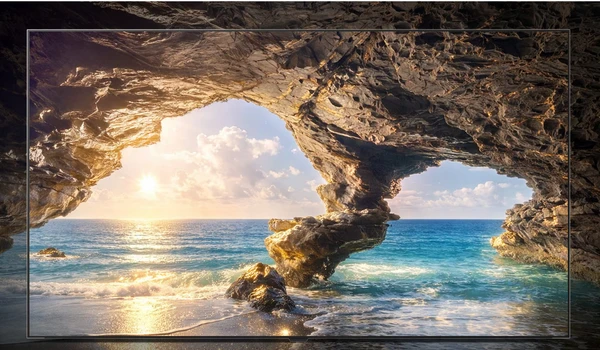 LG OLED83W69LA affichant une grotte face à la mer, illustrant le contraste et les couleurs HDR de la dalle OLED