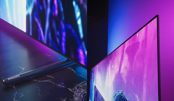 Gros plan sur le pied siglé Philips et le cadre métallique fin du téléviseur Philips 65OLED951 allumé