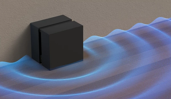 Illustration du caisson Sony Sub 9 noir posé au sol avec des ondes sonores bleues se propageant dans la pièce